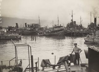 MILNE BAY, NEW GUINEA, 1944-03-08. A VIEW OF THE NAVAL SHIPPING BASE. (NAVAL HISTORICAL COLLECTION)