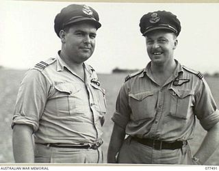 LAE AREA, NEW GUINEA. 1944-12-08. 406739 FLIGHT LIEUTENANT H.E. TEEDE, PILOT (LEFT) AND 401961 FLIGHT LIEUTENANT A.M. JACKSON, NAVIGATOR (RIGHT), RAAF CREW MEMBERS OF GENERAL SIR THOMAS BLAMEY'S ..