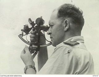 AT SEA. 1944-09/08. LIEUTENANT M.E. MATHERS RAN, CAPTAIN OF THE RAN CORVETTE, GEELONG "SHOOTING OF THE SUN" TO GET THE VESSEL'S BEARINGS AS SHE PROCEEDS ON HER PATROL ALONG THE COAST OF NEW GUINEA