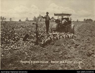 Ploughing in green manure with tractor and four disc plough