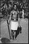 Man posing with old police belt and afui, also alafolo, club