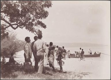 Locals greeting missionaries from the Southern Cross on beach at Rowa, Banks Islands, 1906 / J.W. Beattie