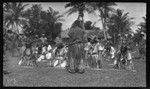 Dance on Aitutaki, lead dancer's legs swollen from elephantiasis
