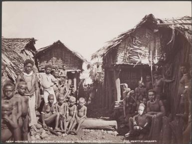 Local people gathered near the womens landing place of Ferasiboa, Malaita, Solomon Islands, 1906 / J.W. Beattie