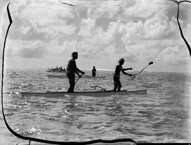 [Pacific Island men fishing from canoes]