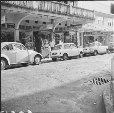 Cars parked along street besides shops, Fiji, November 1966 / Michael Terry