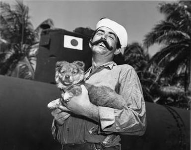 Sailor Holding a Puppy