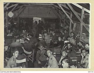 TOROKINA, BOUGAINVILLE. 1945-04-21. INSIDE THE RED CROSS HUT AT 2/3 CONVALESCENT DEPOT. IDENTIFIED PERSONNEL ARE:- LANCE-CORPORAL T. OSTER (1); PRIVATE F.J. HUNT (6); PRIVATE D. HUMPHRIES (8); ..