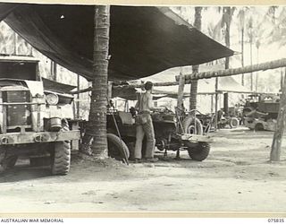 ALEXISHAFEN, NEW GUINEA. 1944-09-13. THE MOBILE CANVAS WORKSHOPS OF THE 133RD BRIGADE WORKSHOPS. TO JOIN TO PHOTOGRAPH NO. 75834. IDENTIFIED PERSONNEL IS:- NX79557 CRAFTSMAN L.C. NELSON (1)