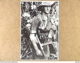 GUY'S POST, FARIA RIVER AREA, NEW GUINEA. 1943-11-08. VX120971 PRIVATE F. D. RILEY OF BURNLEY, VIC, AND OF THE 2/33RD AUSTRALIAN INFANTRY BATTALION MOVING TO GUY'S POST TO RELIEVE MEMBERS OF THE ..