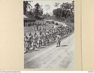 TOROKINA, BOUGAINVILLE. 1945-09-21. JAPANESE TROOPS FROM NAURU ISLAND, HAVING ARRIVED AT TOROKINA PER SS RIVER BURDEKIN, MARCH ALONG THE PIVA ROAD. IT IS TEN MILES TO THE PRISON COMPOUND AT THE ..