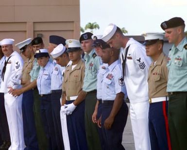 United States Joint Service members stand by for the call to formation during the presidential visit to Hawaii for the first time while holding the presidential office