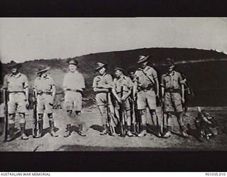 ONONGE, PAPUA, 1942. PORTRAIT OF A GROUP OF SPOTTERS FROM THE NEW GUINEA AIR WARNING WIRELESS COMPANY (NGAWW) AT ONONGE MISSION STATION. LEFT TO RIGHT: DICK (SNOW) WEBB, JACK POWDERHAM, LIEUTENANT ..