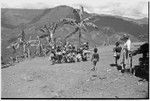 Pig festival, singsing preparations, Tsembaga: adolescent girls on dance ground, watched by Ann Rappaport