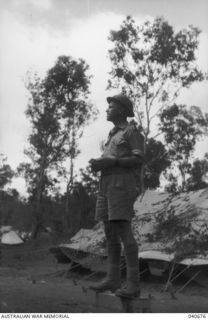 Sogeri, New Guinea. 1942-10-04. Lieutenant Colonel Albert Caro, Commanding Officer of 2/16th Battalion, 21st Australian Infantry Brigade, addressing his troops before a review of the Brigade by ..