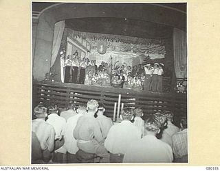 LAE, NEW GUINEA. 1944-08-01. THE GRAND FINALE OF "THE WHITE HORSE INN" STAGED FOR THE BENEFIT OF PATIENTS BY THE STAFF OF 2/7TH GENERAL HOSPITAL, AUSTRALIAN ARMY MEDICAL CORPS