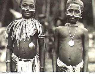 KAMALGAMAN ANCHORAGE, JACQUINOT BAY, NEW BRITAIN. 1944-12-31. TWO NATIVE CHILDREN, AT THE SING-SING IN THE AUSTRALIAN NEW GUINEA ADMINISTRATIVE UNIT NATIVE COMPOUND