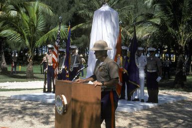 Marine Corps Colonel J. Karl Miller, commander, Marine Barracks Guam, speaks at the Congressional Medal of Honor Monument dedication ceremony. The monument was erected to honor four Marines for their heroism during World War II. They are Captain Louis Wilson Jr., Private First Class (PFC) Leonard Mason, PFC Luther Skaggs and PFC Frank Witek