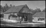 Man in front of house