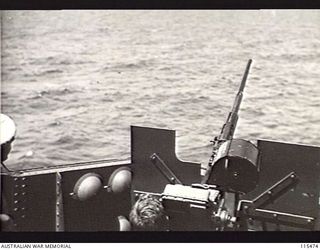OFF KAHILI POINT, BOUGAINVILLE. 1945-09-07. WEAPONS UNDER TEST ABOARD THE RAN FRIGATE, HMAS DIAMANTINA NEAR THE MOUTH OF THE MIVO RIVER DURING THE TWENTY FOUR HOUR WAIT FOR THE ARRIVAL OF THE ..