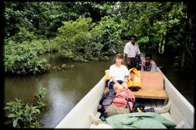 Viv Whitaker +2 on boat on river