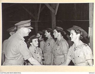 LAE AREA, NEW GUINEA, 1945-06-28. HIS ROYAL HIGHNESS, THE DUKE OF GLOUCESTER, GOVERNOR-GENERAL OF AUSTRALIA (1) MEETING OFFICERS AT THE AWAS BARRACKS DURING HIS TOUR OF INSPECTION OF AUSTRALIAN ..