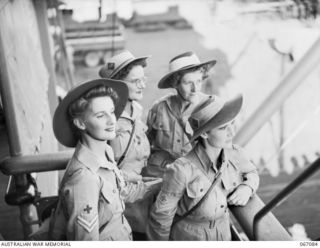 Australian Army Medical Women's Serevice (AAMVS) members of the 2/1st General Hospital waiting to disembark from the HMT Ormiston on their arrival from New guinea. Identified are: WFX17041 Corporal ..