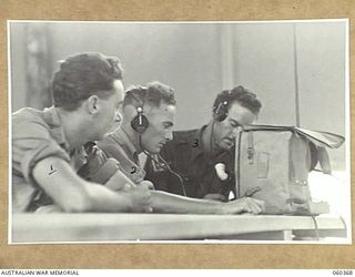 SOGERI, NEW GUINEA. 1943-11-20. STUDENTS OF THE SCHOOL OF SIGNALS, NEW GUINEA FORCE WORKING WITH A 108 ARMY WIRELESS SET AT THE SCHOOL