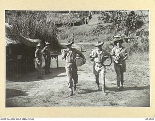 1943-06-29. NEW GUINEA. WAU-MUBO AREA. TYPICAL COUNTRY IN THE WAU-MUBO AREA. DRIVERS PAT CORAM, OF MELBOURNE, HARRY JENKINS, OF MELBOURNE, AND D. BEECROFT, OF MELBOURNE, START OFF ALONG THE TRAIL. ..