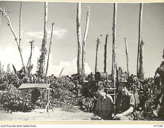 TOROKINA, BOUGAINVILLE ISLAND. 1944-12-24. NX201 MAJOR H.E. GALE, MBE, CAMP COMMANDANT, HEADQUARTERS, 2ND AUSTRALIAN CORPS (1) AND SERGEANT C.F. O'NEILL, MILITARY HISTORY FIELD TEAM ATTACHED TO ..