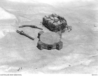 NEW GUINEA. 1943-11-24. JAPANESE MAGNETIC ANTI-TANK MINE AND BOOSTER CHARGE. THIS EQUIPMENT HAS BEEN PREPARED FOR DEMONSTRATION PURPOSES BY THE COMMAND ROYAL ENGINEERS HEADQUARTERS, 9TH AUSTRALIAN ..