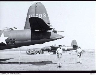 PAPUA, 1942-07-27. THE MASSIVE TAIL OF AN AMERICAN B26 MARAUDER BOMBER AIRCRAFT, SERIAL NO. 01503, OF US AIR FORCE 22ND BOMB GROUP, PROBABLY AT 7 MILE STRIP AIRFIELD. OTHER MARAUDER BOMBER AIRCRAFT ..