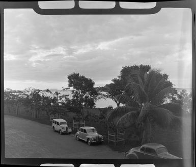 Cars parked on the road beside the sea, Lautoka, Fiji