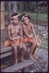 Adolescent girls wearing short fiber skirts, flower garlands, and mourning necklaces