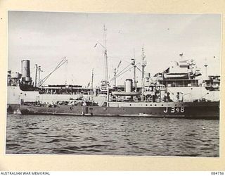 MIOS WUNDI, DUTCH NEW GUINEA. 1944-11-12. HMAS STAWELL IN HARBOUR REFUELLING FROM USS VICTORIA, USN