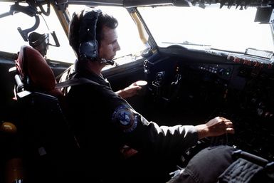 A pilot flies a KC-135 Stratotanker aircraft from Guam to Darwin Royal Australian Air Force Base, Australia, during Exercise Glad Customer '82. The pilot is from the 906th Air Refueling Squadron, 43rd Strategic Wing, Pacific Task Force