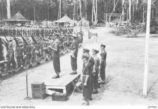 TOROKINA, BOUGAINVILLE ISLAND. 1944-12-06. VX38969 MAJOR-GENERAL W. BRIDGEFORD, CBE, MC, GOC, 3RD DIVISION (1) TAKING THE SALUTE FROM PERSONNEL OF D COMPANY, 15TH INFANTRY BATTALION AS THEY MOVE ..