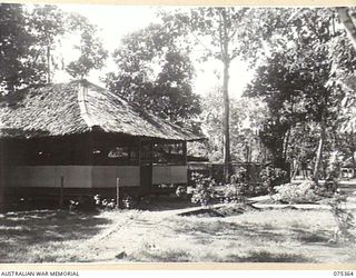 LAE, NEW GUINEA. 1944-02-18. THE OFFICES OF THE GENERAL OFFICER COMMANDING WITH THE MESS IN THE BACKGROUND AT HEADQUARTERS, NEW GUINEA FORCE