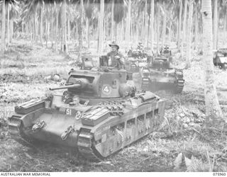 MILILAT, NEW GUINEA. 1944-09-12. TROOPERS OF THE 2/4TH ARMOURED REGIMENT MANOEUVRING THEIR MATILDA TANKS AMONG THE COCONUT PALMS NEAR THEIR CAMP. IDENTIFIED PERSONNEL IS: SX17370 TROOPER H.J. MEGAW ..