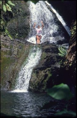 Woman in waterfall, Rarotonga