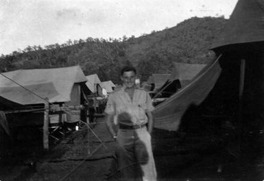 Man in front of camp