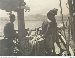 PORT MORESBY, PAPUA. C. 1944. PAPUAN NATIVES EMPLOYED AS CREW MEMBERS ON A SAILING VESSEL OF THE RAAF RESCUE SERVICE