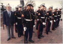 World War II veteran joins Marines at the Naval Air Station in commemoration of Pearl Harbor attack, Atlanta, Georgia, December 7, 1988.