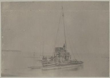 Fijian war boat in a bay, Fiji, approximately 1895