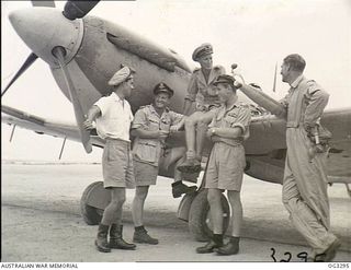 LORENGAU, MANUS ISLAND, ADMIRALTY ISLANDS. 1945-08-25. MEMBERS OF A ROYAL NAVY SEAFIRE SQUADRON AND RAAF AIRMEN AT A ROYAL NAVY BASE ON MANUS ISLAND. LEFT TO RIGHT: LIEUTENANT (LT) E. B. GRAY, ..