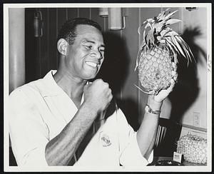 Pineapples for Press- Kolo Duke Sabedong of Hilo, Hawaii, brought some Hawaiian pineapples to press luncheon at Marie's Keyboard yesterday and passed them around. The 6-7, 230 pound heavyweight champ of the islands meets Tom McNeeley in 10-round bout at Arena next Monday night.