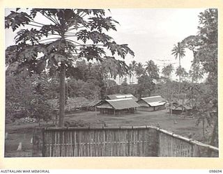 RABAUL, NEW BRITAIN. 1945-11-08. THE MESS AREA AND ORDERLY ROOM VIEWED FROM THE OFFICERS' MESS, 51 AND 55 ORDNANCE FIELD PARK