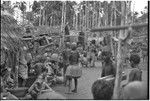 Mortuary ceremony, Omarakana: in village center, people wait for procession of mourning women