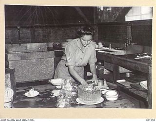 BOUGAINVILLE, 1945-04-18. PRIVATE B.M. NEALE, AUSTRALIAN ARMY MEDICAL WOMEN'S SERVICE, ON MESS DUTY AT 2/1 GENERAL HOSPITAL