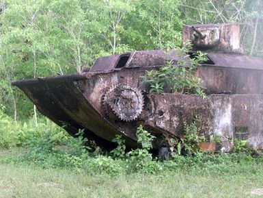 An American Landing Vehicle Tracked (Armored)(Mark 1), LVT(A)-1, that was left after the Battle of Peleliu during World War Two on the island of Peleliu. Photograph taken as part of Exercise KOA THUNDER 2001. Marines from Aviation Support Element, Kaneohe Bay, Hawaii, 1ST Marine Air Wing (MAW), Okinawa, Japan, and 3rd Marines 7th Battalion, 29 Palms, California, participated in KOA THUNDER on the island of Guam from July 9 to July 14. The purpose of the exercise was to demonstrate the Marine Corps ability to deploy in the South Pacific from places other than Okinawa, Japan